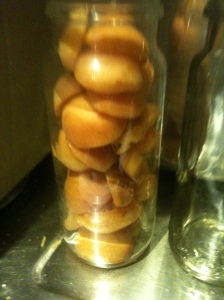 First jar of apricot halves . I figured out a better way to stack them in after this one.